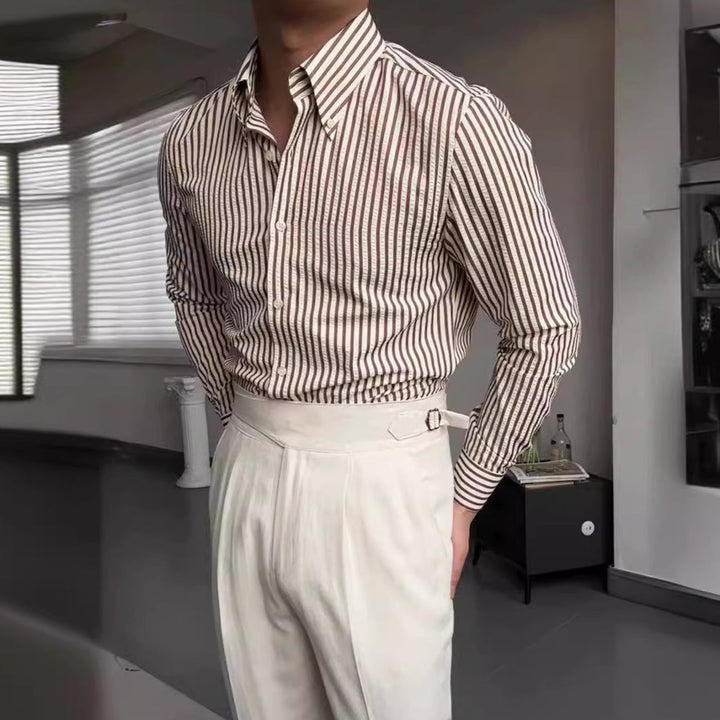 Men's stylish striped long-sleeve button-down dress shirt, perfect for smart casual or formal occasions. Wardrobe essential.