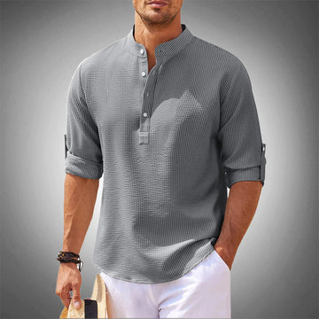 Men's stylish white button-down long sleeve shirt with tailored fit for modern spring casual fashion.