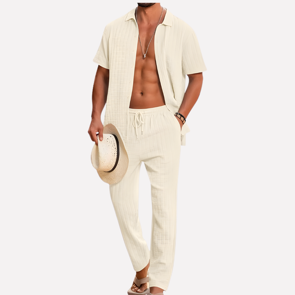Stylish men's two-piece summer outfit: textured shirt & relaxed fit trousers for casual fashion.