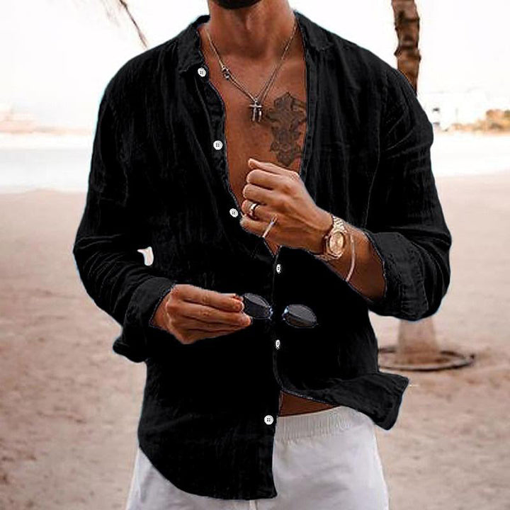 Comfortable men's solid long sleeve button shirt, ideal for casual summer style.