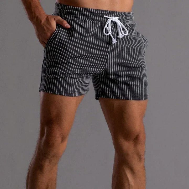 Men's performance fitness shorts, super stretch design for ultimate comfort in gym & athletic training.
