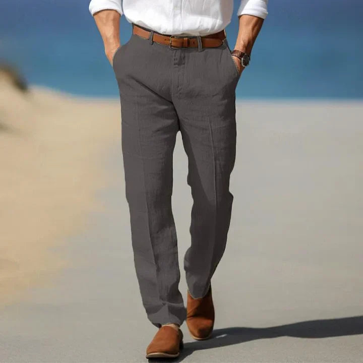 Close-up of fabric texture on men's slim fit casual trousers, showcasing quality tailoring