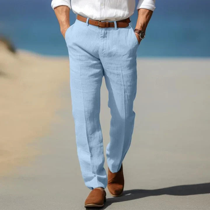 Model wearing men's tailored slim fit casual trousers, highlighting the modern cut