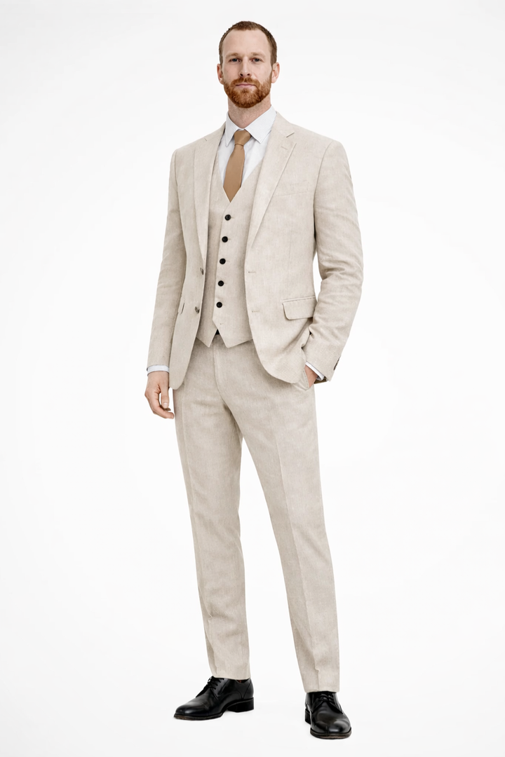 Men's three-piece suit with visible waistcoat, ideal formal wear for wedding guests & events.