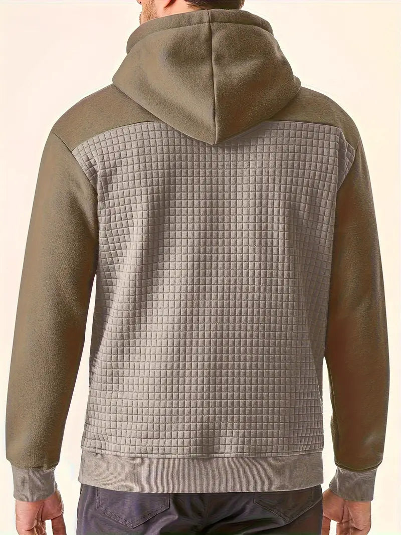Side profile of men wearing a long sleeve textured grid hooded sweatshirt, versatile look