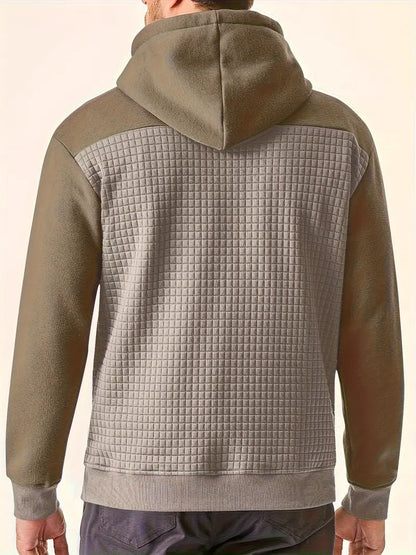 Side profile of men wearing a long sleeve textured grid hooded sweatshirt, versatile look