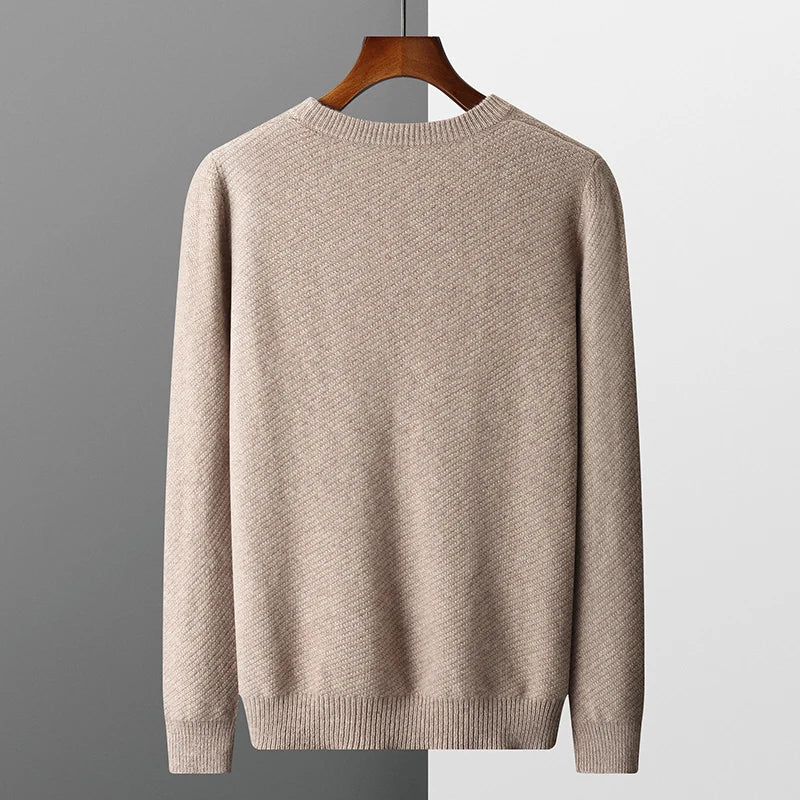 Casual men's long sleeve pullover, a comfortable textured knit crew neck top with ribbed cuffs.