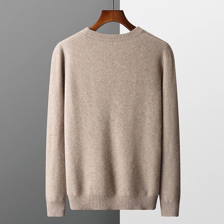 Casual men's long sleeve pullover, a comfortable textured knit crew neck top with ribbed cuffs.