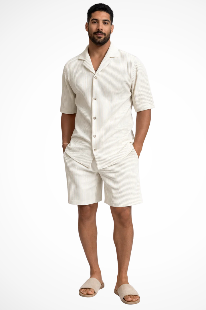 Men's summer fashion: textured short-sleeve button-up shirt paired with comfortable matching shorts.
