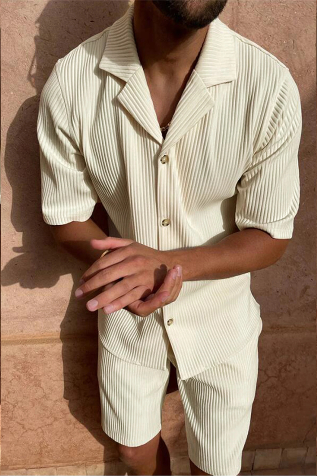 Effortless men's textured co-ord set for summer vacation: short sleeve shirt & shorts, perfect for leisure.