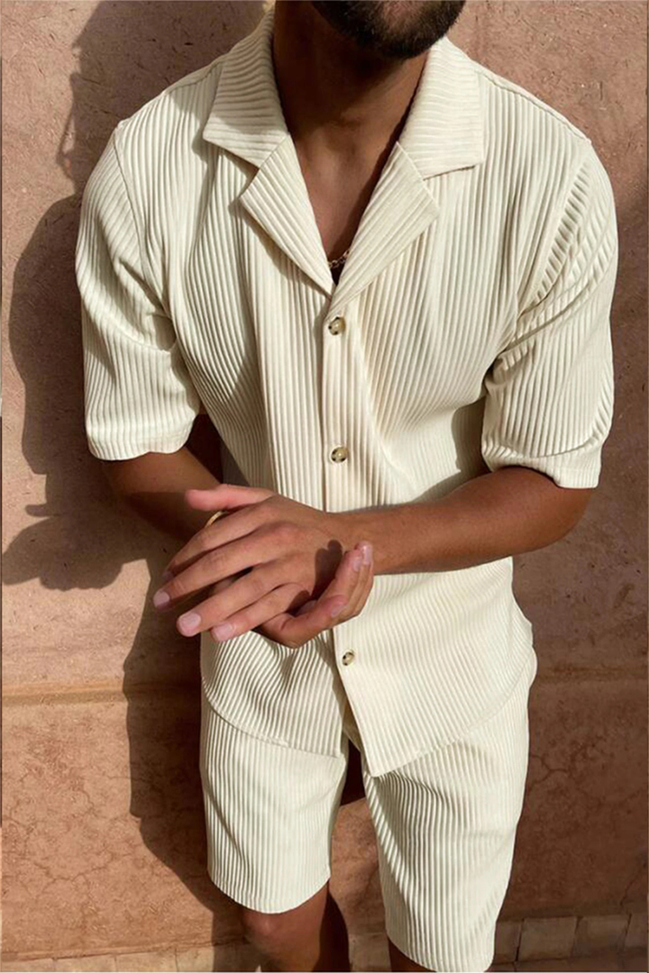 Effortless men's textured co-ord set for summer vacation: short sleeve shirt & shorts, perfect for leisure.
