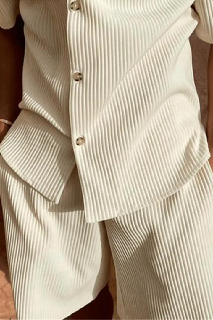Complete men's summer outfit featuring a stylish textured short sleeve shirt and comfortable shorts.