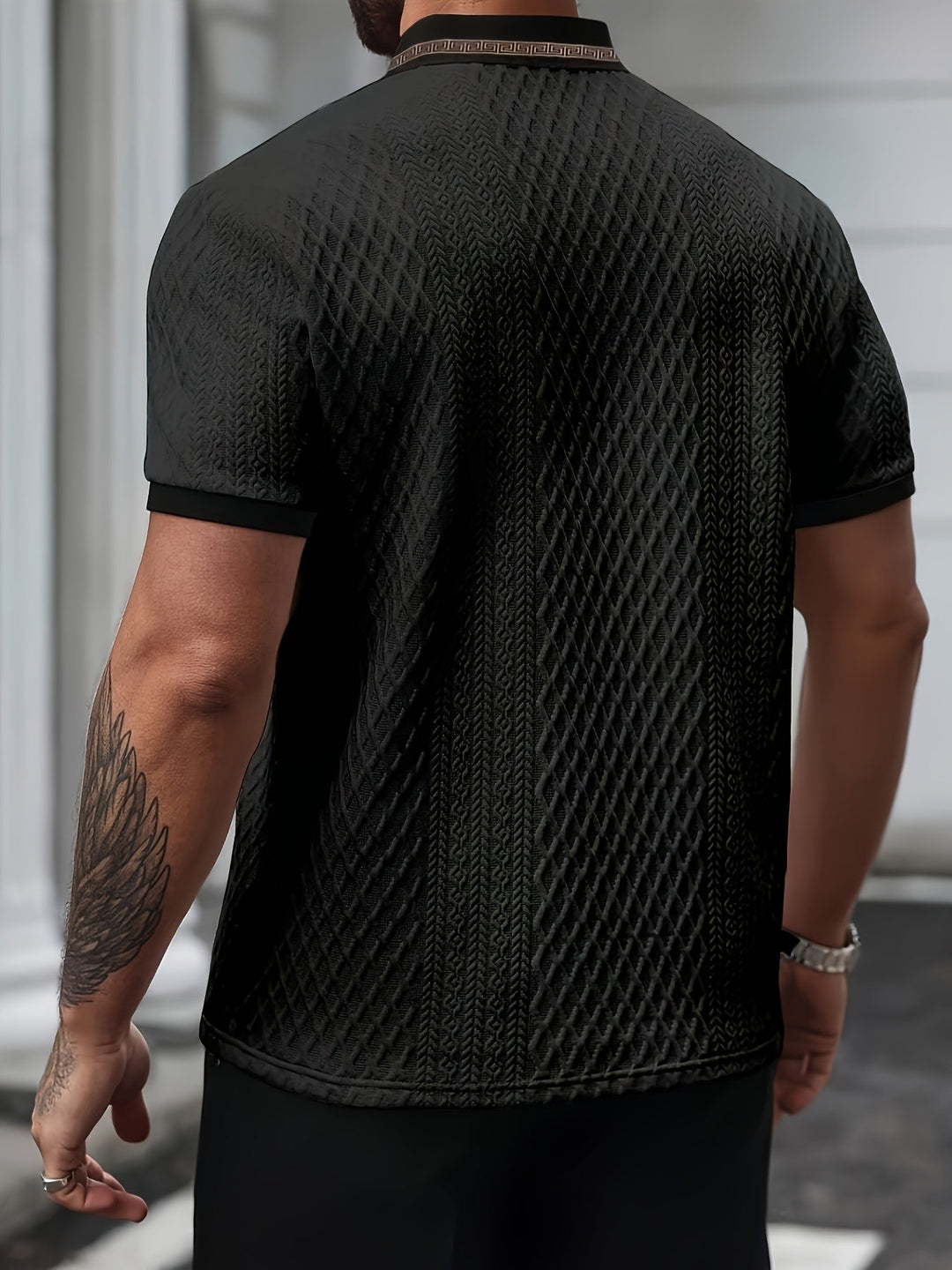 Slim fit men's polo shirt with textured fabric, great for a modern smart casual look.