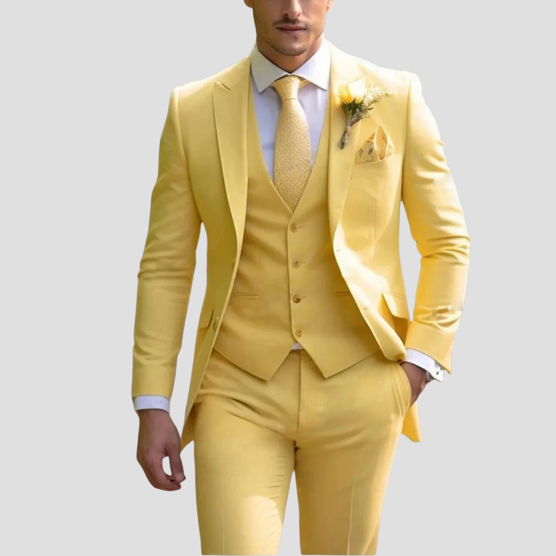 Pink men's three-piece slim fit tailored suit. Stylish formal wear for unique wedding outfits or events.