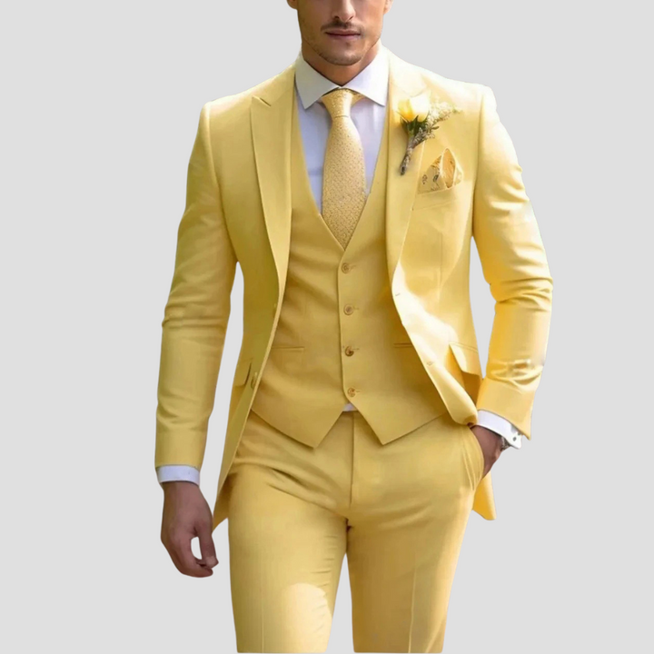 Pink men's three-piece slim fit tailored suit. Stylish formal wear for unique wedding outfits or events.