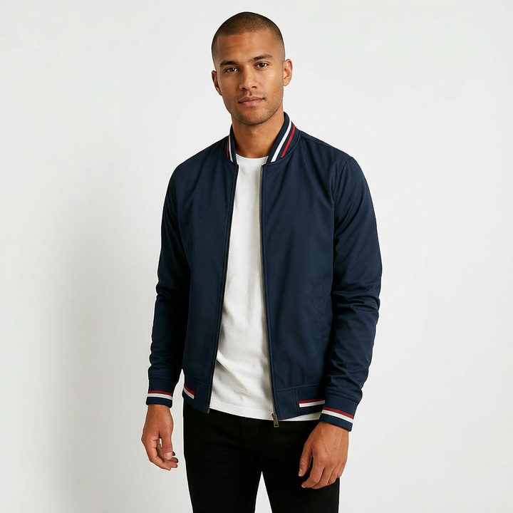 Men's trendy windproof bomber jacket. Features a modern design, full zip closure, and comfortable ribbed cuffs.