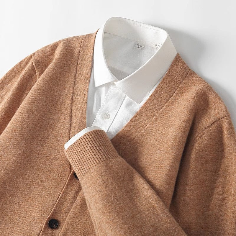 Stylish men's button-down cardigan sweater. V-neck, long sleeve knit ideal for fall and winter fashion.