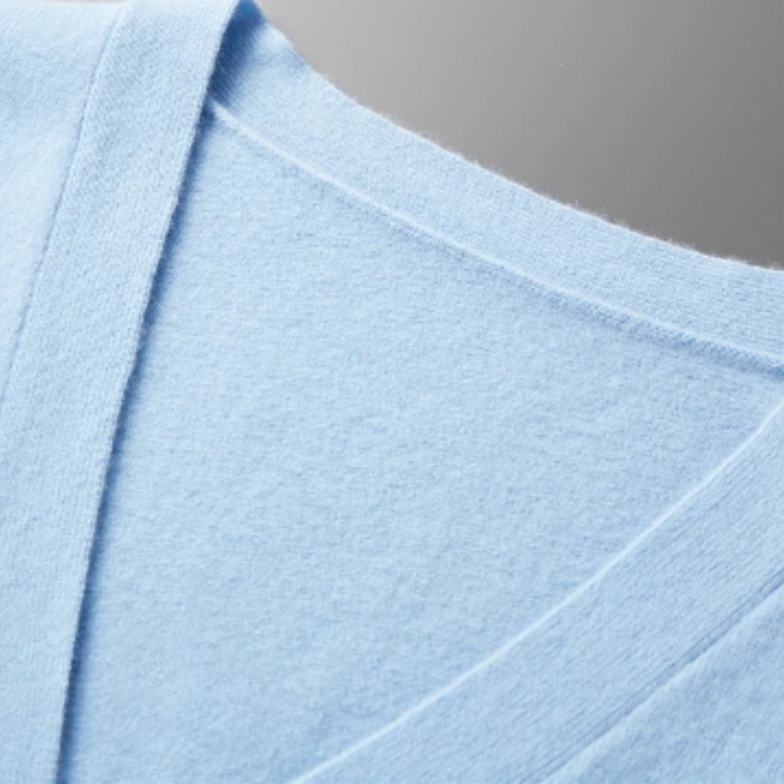 Men's long-sleeve V-neck cardigan with ribbed details, perfect for layering & everyday wear.