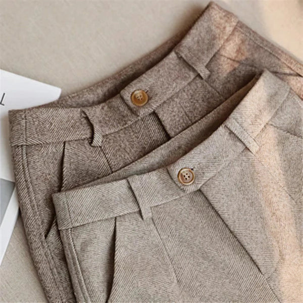 Stylish men's brown high waist pleated trousers, vintage cut, perfect for smart casual wear.