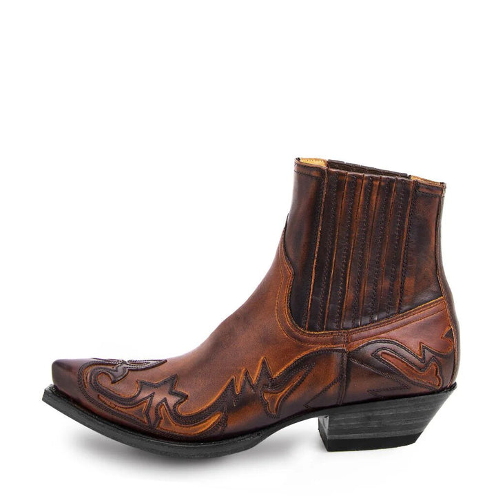 Rugged leather men's cowboy boots featuring detailed stitching along shaft and vamp, showcasing vintage western style.