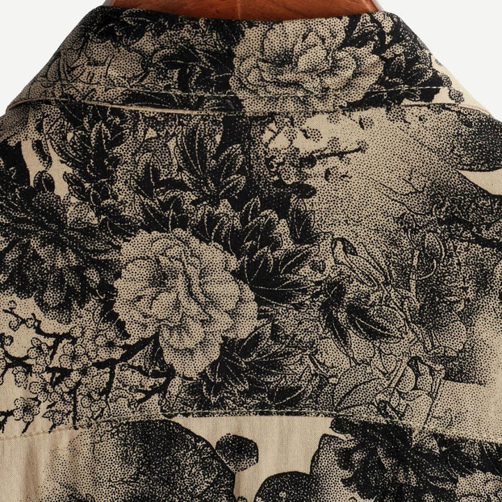 Casual men's short sleeve shirt with vibrant vintage blossom floral print, ideal for summer relaxation.