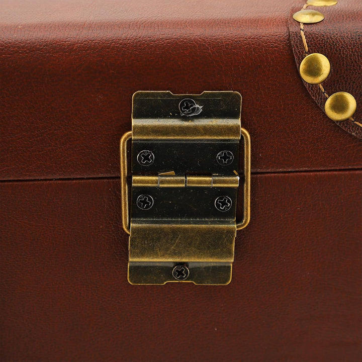 Vintage heritage brown leather travel trunk for men. Durable carry-on overnight case with secure locking.