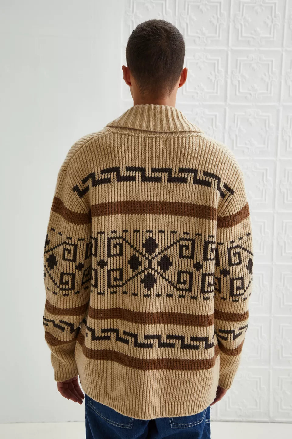 Detailed view of the jacquard knit pattern on a men's vintage khaki zipper cardigan.