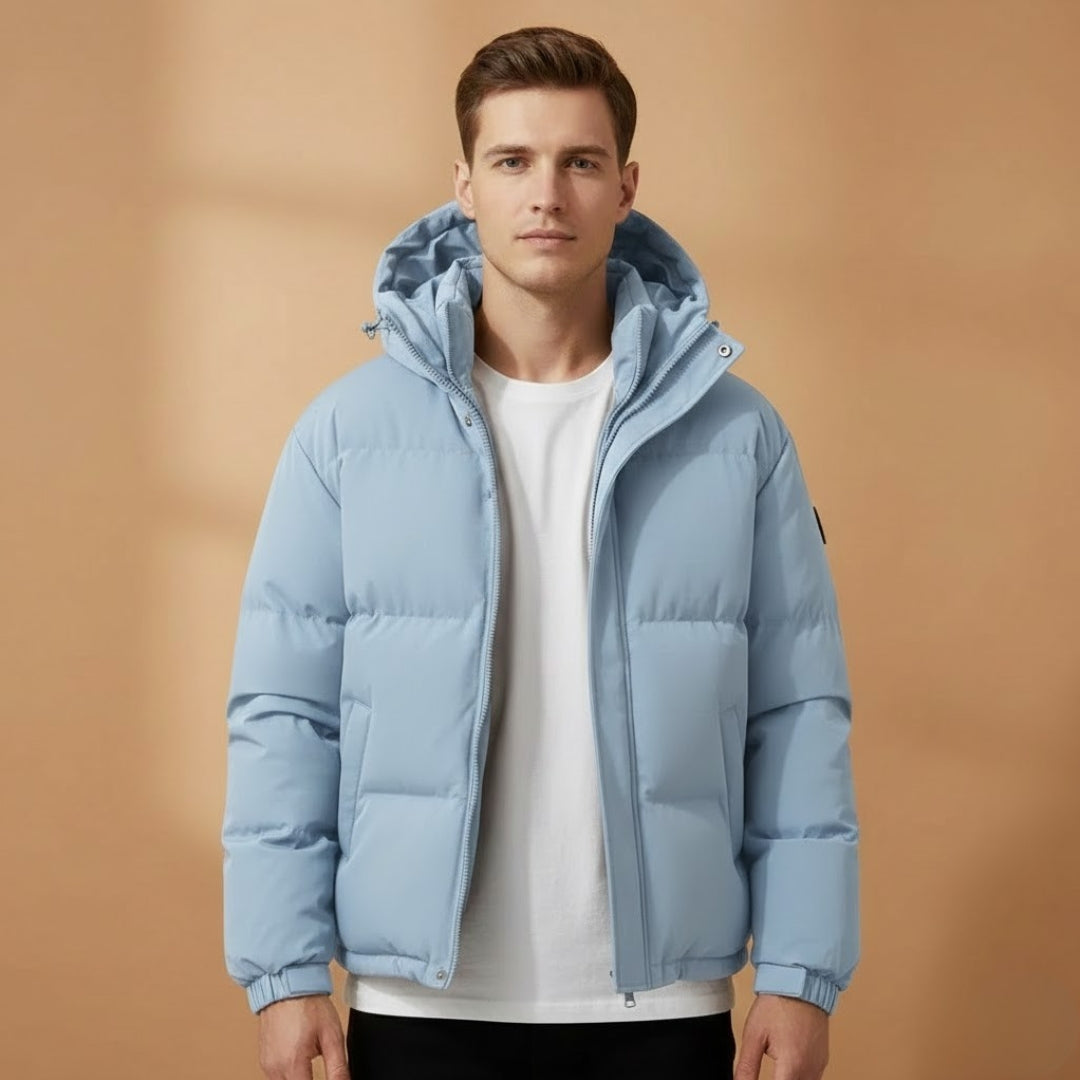Modern men's hooded quilted jacket, practical for cold weather. Warm, lightweight puffer outerwear for versatility.