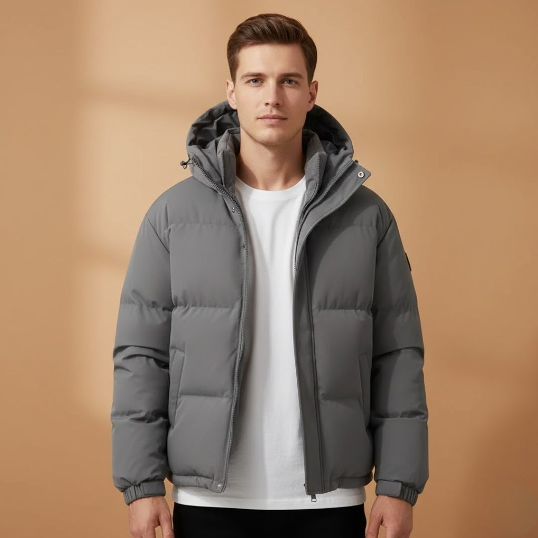 Versatile men's quilted puffer jacket with hood. Zip-up design for casual wear & winter adventures.
