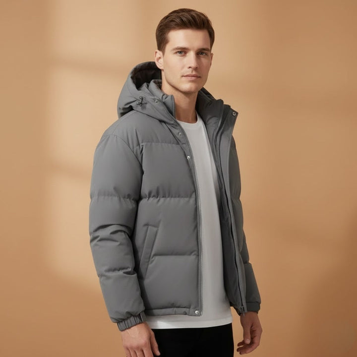 Stylish men's hooded winter jacket. Quilted design offers warmth & comfort for cold weather outerwear.