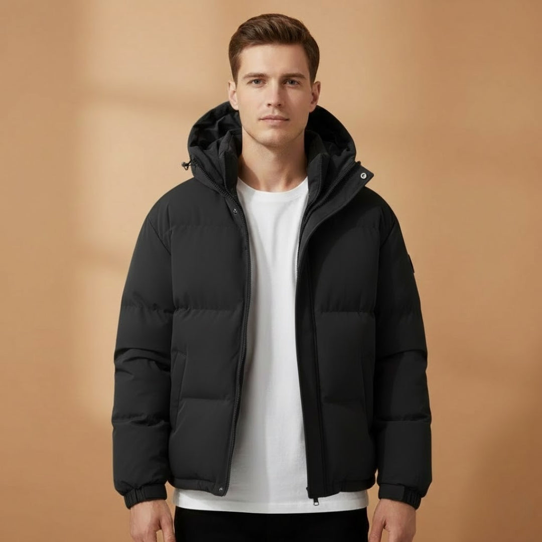 Side view of men's hooded quilted jacket, showing lightweight fit. Warm puffer outerwear for cold daily wear.