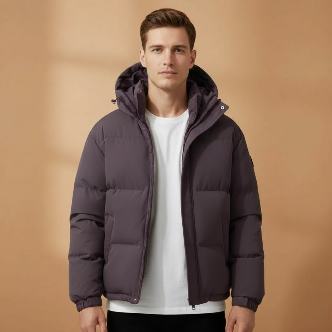 Close-up of quilted texture on men's hooded jacket. Warm & lightweight puffer outerwear, ideal for cold.