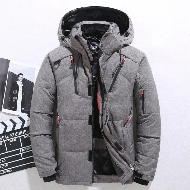 Men's warm puffer winter jacket with hood, ideal for cold weather. Features durable, stylish quilted design.