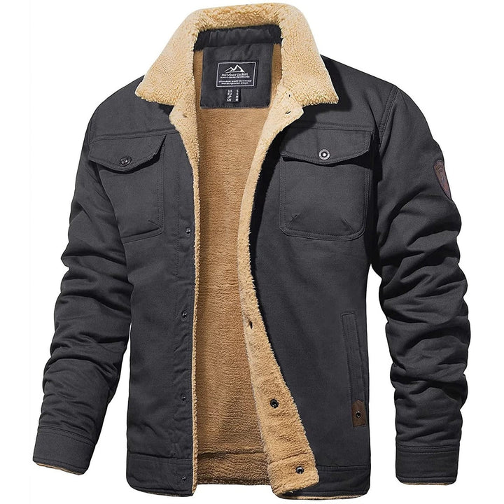 Detail of the zipper and pockets on a men's warm sherpa-lined cold weather jacket, high quality.