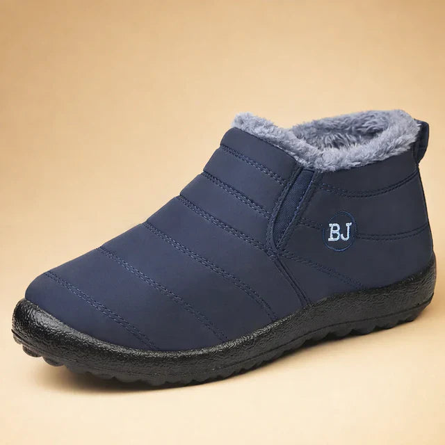 Cozy men's slip-on ankle boots, perfect for outdoor winter activities. Comfortable & durable men's footwear.