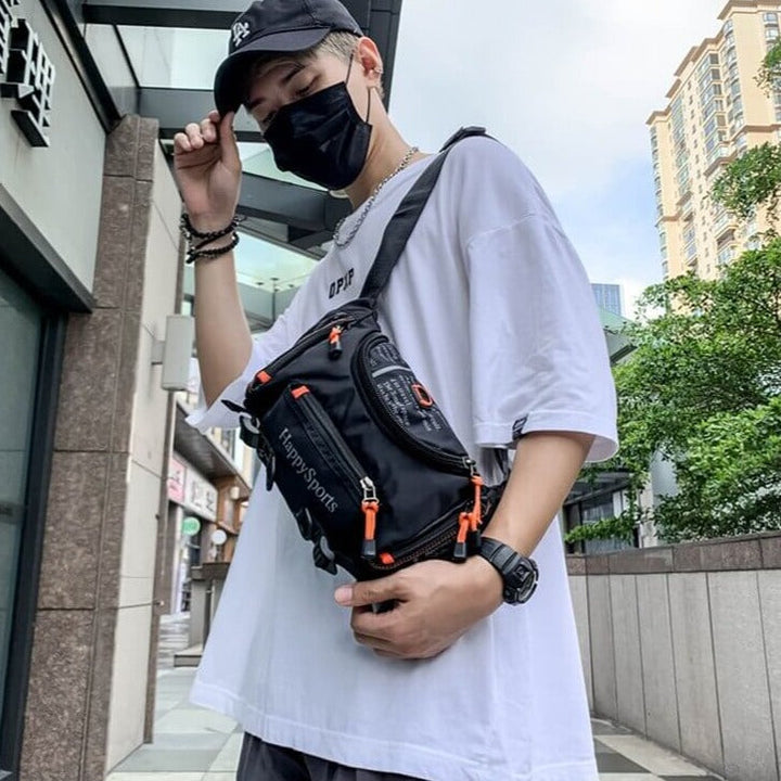 Adaptable men's water-resistant bag, converts from waist pack to sling for travel ease.
