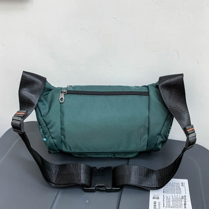 Compact men's water-resistant waist bag, ideal for travel, hiking & outdoor essentials.