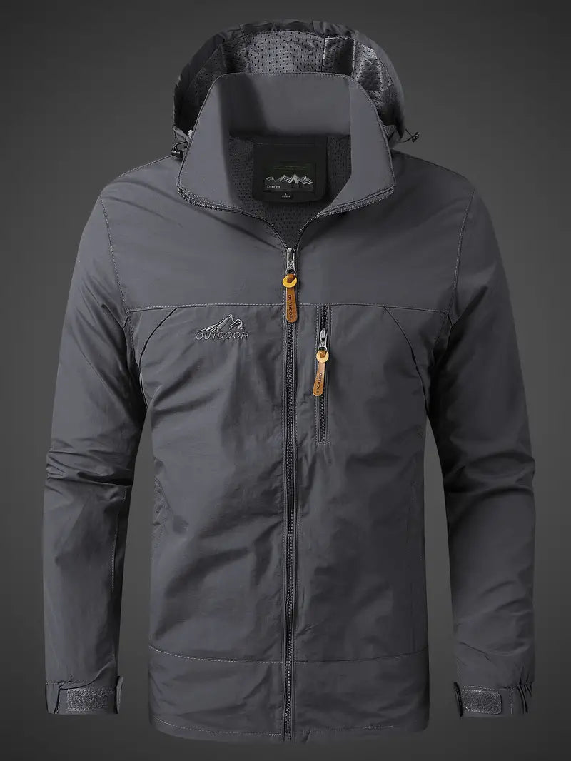 Packable men's travel jacket. Lightweight, hooded, waterproof rain gear & windbreaker for outdoor trips.