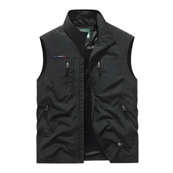 Practical men's waterproof insulated vest with zip pockets for outdoor adventures & winter warmth.