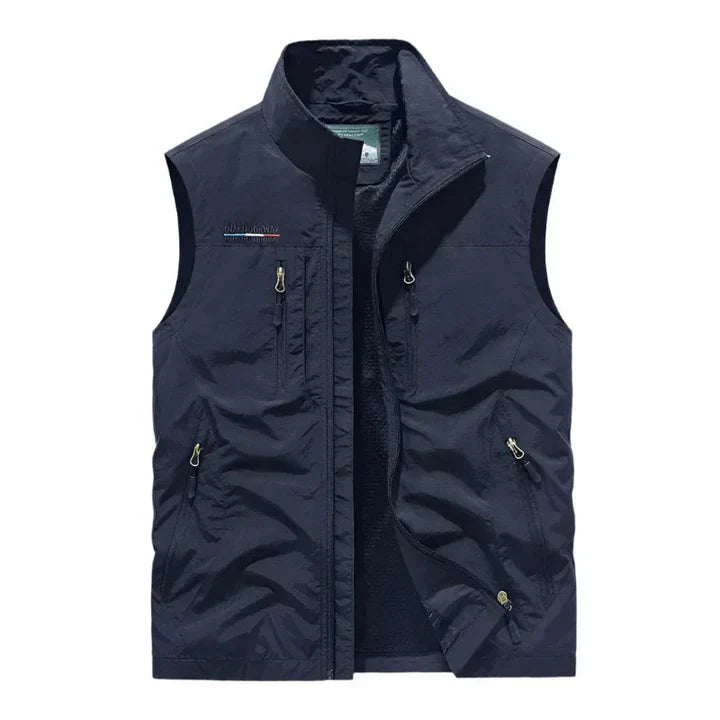Versatile men's waterproof insulated outdoor vest for fall & winter travel, hiking, & casual wear.