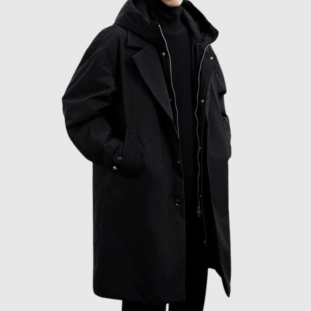 Close-up of a men's black waterproof jacket featuring breathable fabric, perfect rain gear for all weather conditions.