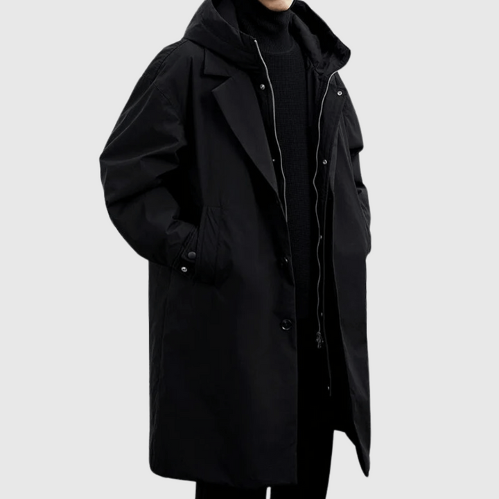 Close-up of a men's black waterproof jacket featuring breathable fabric, perfect rain gear for all weather conditions.