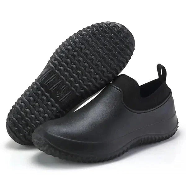 Men's waterproof slip-on gardening shoes with non-slip sole, ideal for outdoor durability & comfort.
