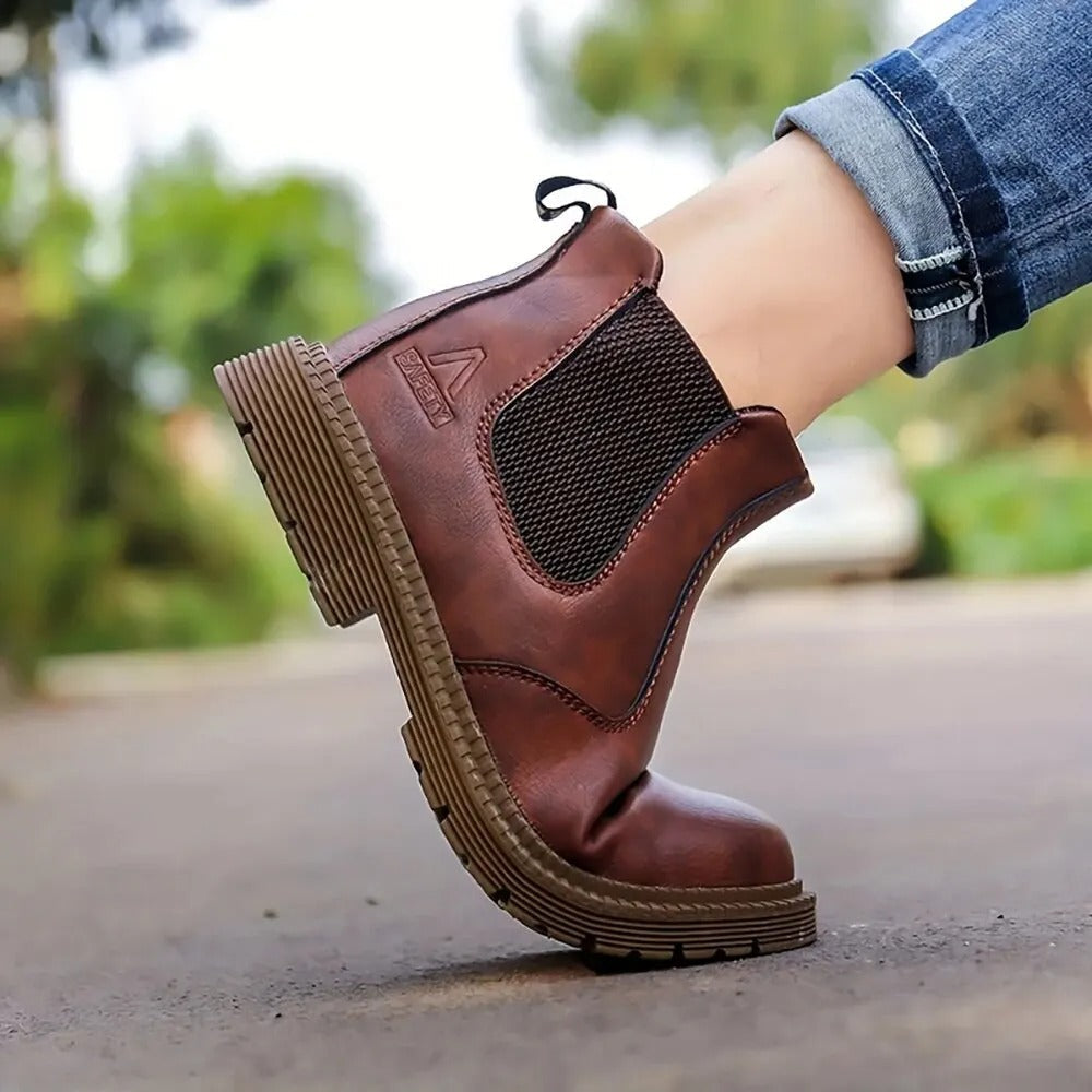 Men's slip-resistant work boots: waterproof, steel toe for secure and safe movement on job.