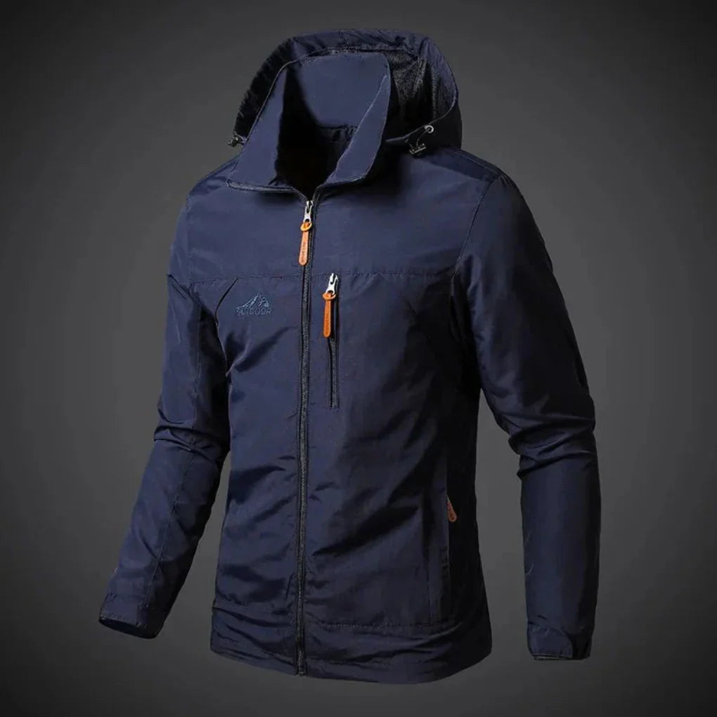Man hiking in a lightweight, waterproof windbreaker. Ideal men's outdoor jacket for travel & adventures.