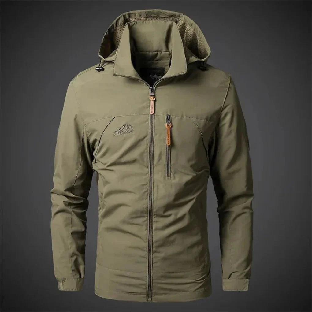 Close-up of embroidered detail on a men's waterproof wind jacket, perfect lightweight outerwear for spring.