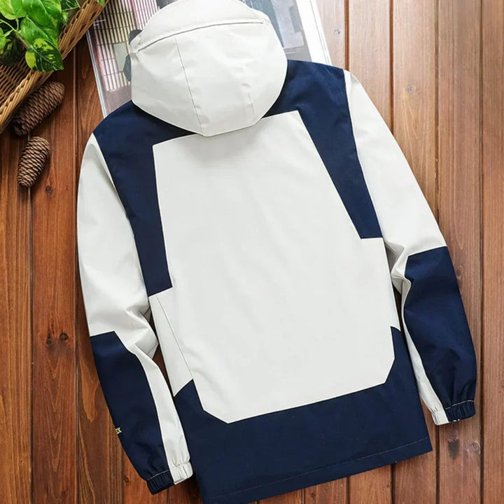 Full zip men's color block rain jacket, hooded for extra protection. Ideal lightweight outerwear for men's fashion.
