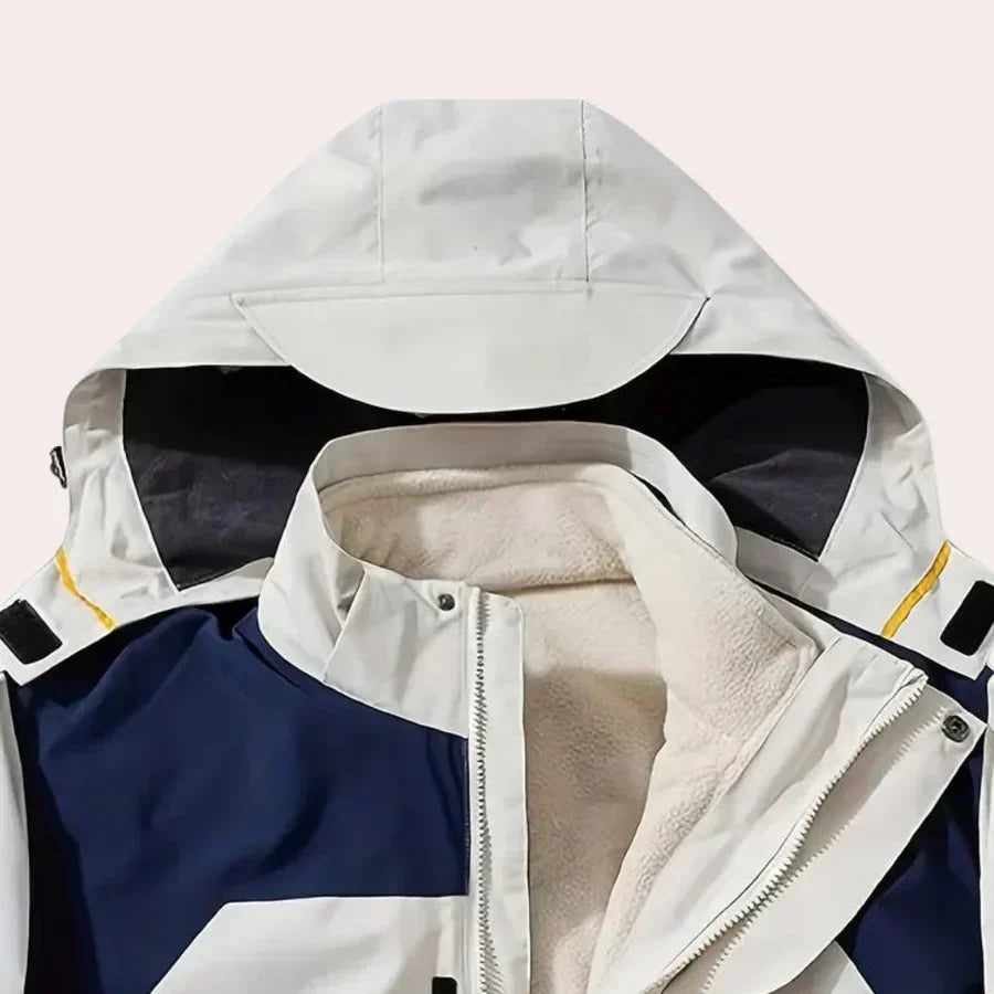 Lightweight men's hooded rain jacket. Modern color block design, full zip windbreaker for comfort and style.
