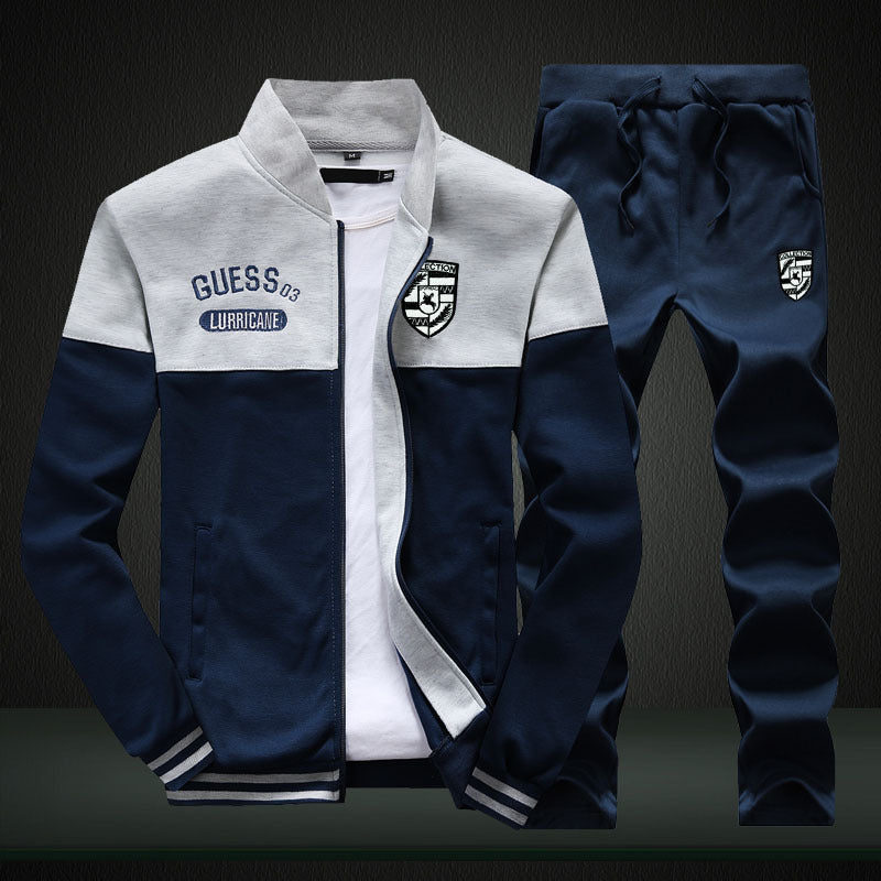 Two-piece men's athletic tracksuit in white & blue. Ideal jogging suit for active men, featuring baseball style.
