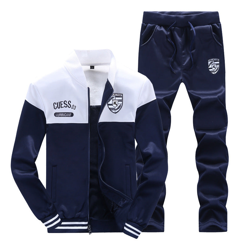 Sporty men's white & blue two-piece tracksuit. Baseball style activewear set, ideal for jogging & casual fashion.
